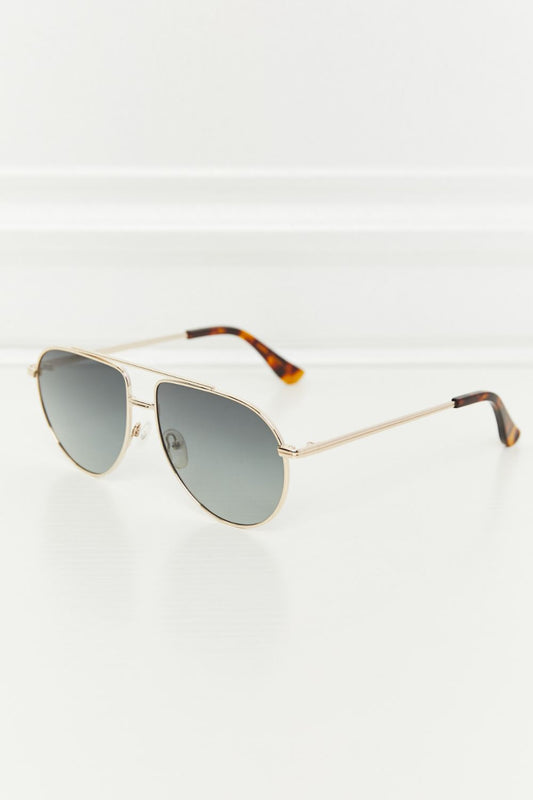 Classic aviator sunglasses with silver frame and gradient lenses for a stylish look