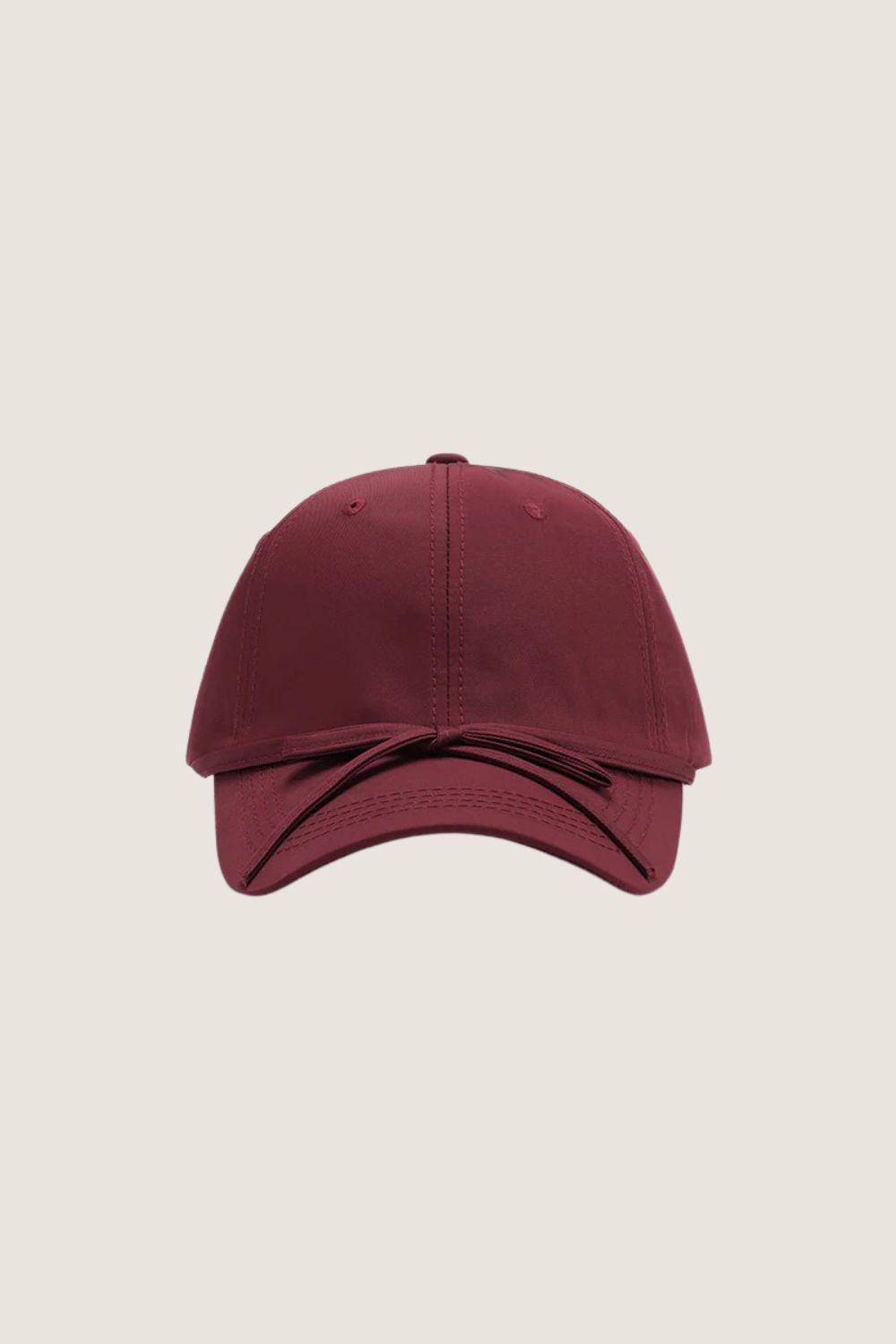 Classic cotton baseball cap in burgundy color with a curved brim and adjustable strap