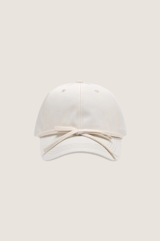 Classic cotton baseball cap in white with a stylish ribbon detail on the front