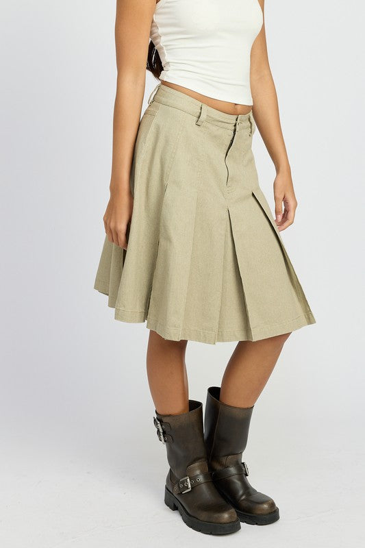 Emory Park Knee Length Pleated Skirt in khaki worn with white top and black boots