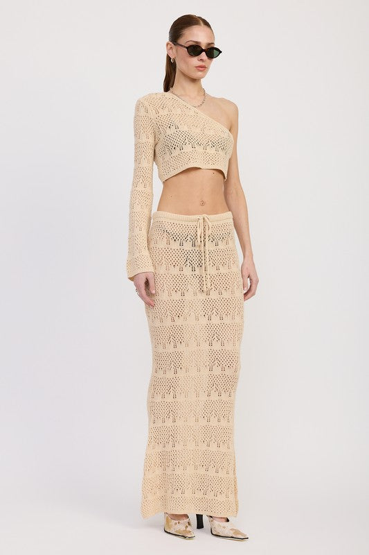 Emory Park Crochet Maxi Skirt With Waist Drawstrings in beige worn with matching one-shoulder crochet top