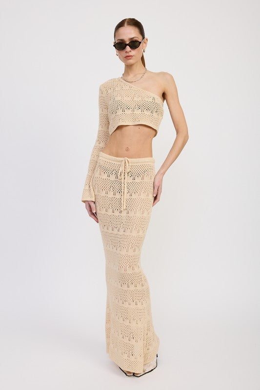 Emory Park Crochet Maxi Skirt With Waist Drawstrings in beige worn with matching one-shoulder crop top