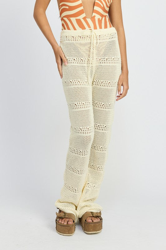 Emory Park Crochet Pants With Drawstrings in cream with open knit pattern worn with platform sandals