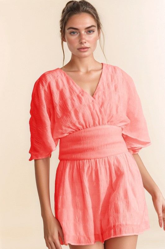Davi & Dani Batwing Sleeve Waist Belt Romper in Coral with V-Neck and Flowy Design