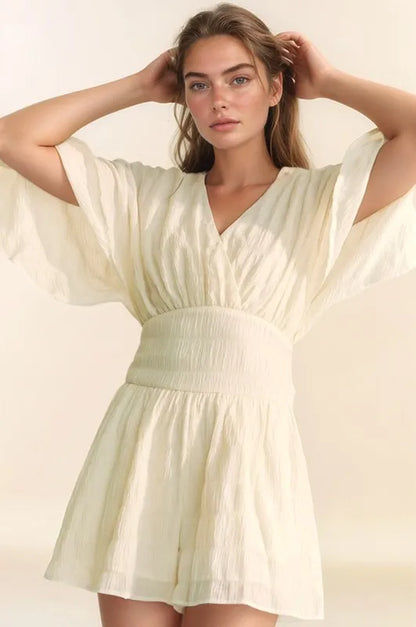 Davi & Dani Batwing Sleeve Waist Belt Romper in Cream with Flowy Fabric and V-Neckline