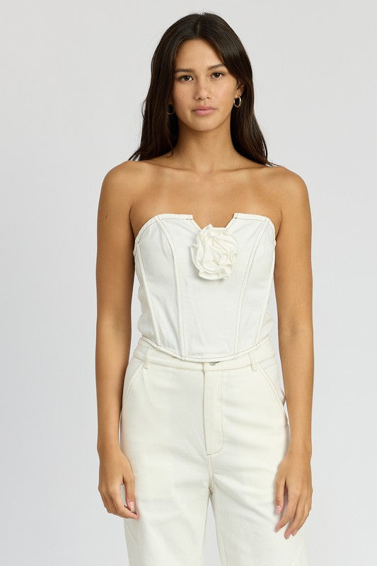 Emory Park Denim Corset Top With Rosette Detail in white worn by model with strapless design
