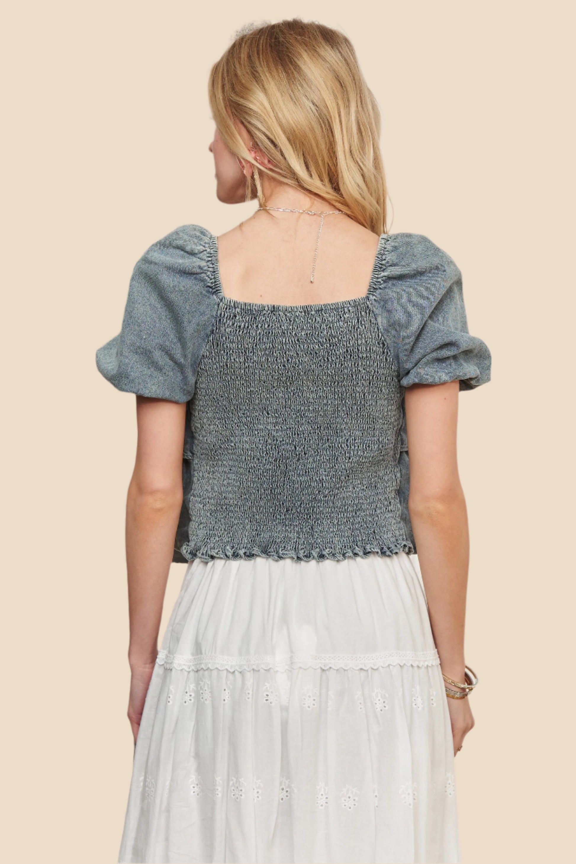 Back view of Denim Layered Ruffle Top featuring puff sleeves and a relaxed fit