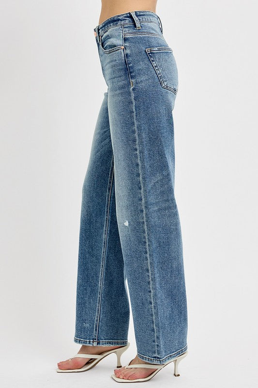Distressed wide leg jeans in light blue wash with a relaxed fit