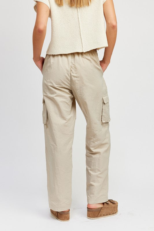 Emory Park beige cargo Straight Leg Pants With Elastic Waistband back view showing side flap pockets and relaxed fit