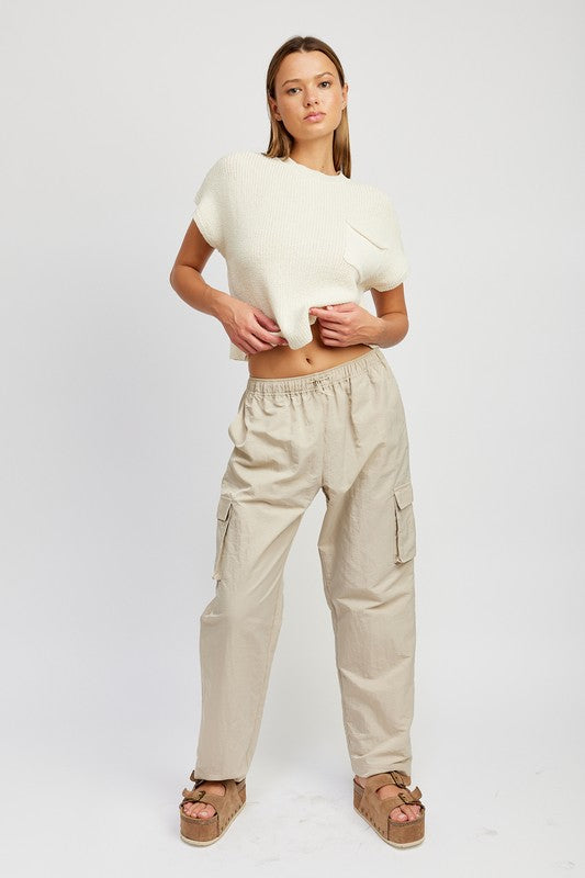 Emory Park model wearing beige Straight Leg Pants With Elastic Waistband cargo pockets and relaxed fit