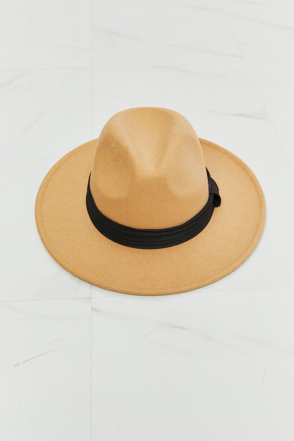 Fame You Got It Fedora Hat in tan with black band on marble floor by Fame