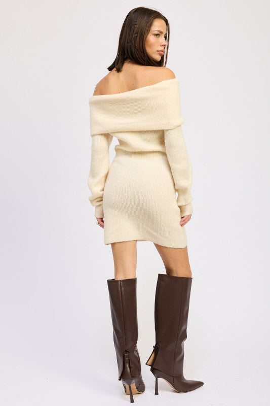 Emory Park Long Sleeve Off-Shoulder Mini Knit Dress in cream shown from back on model wearing brown knee high boots