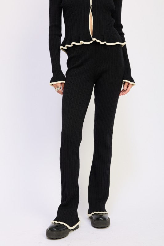 Emory Park Flared Knit Pant With Lettuce Hem black ribbed knit flared trousers paired with matching lettuce hem top