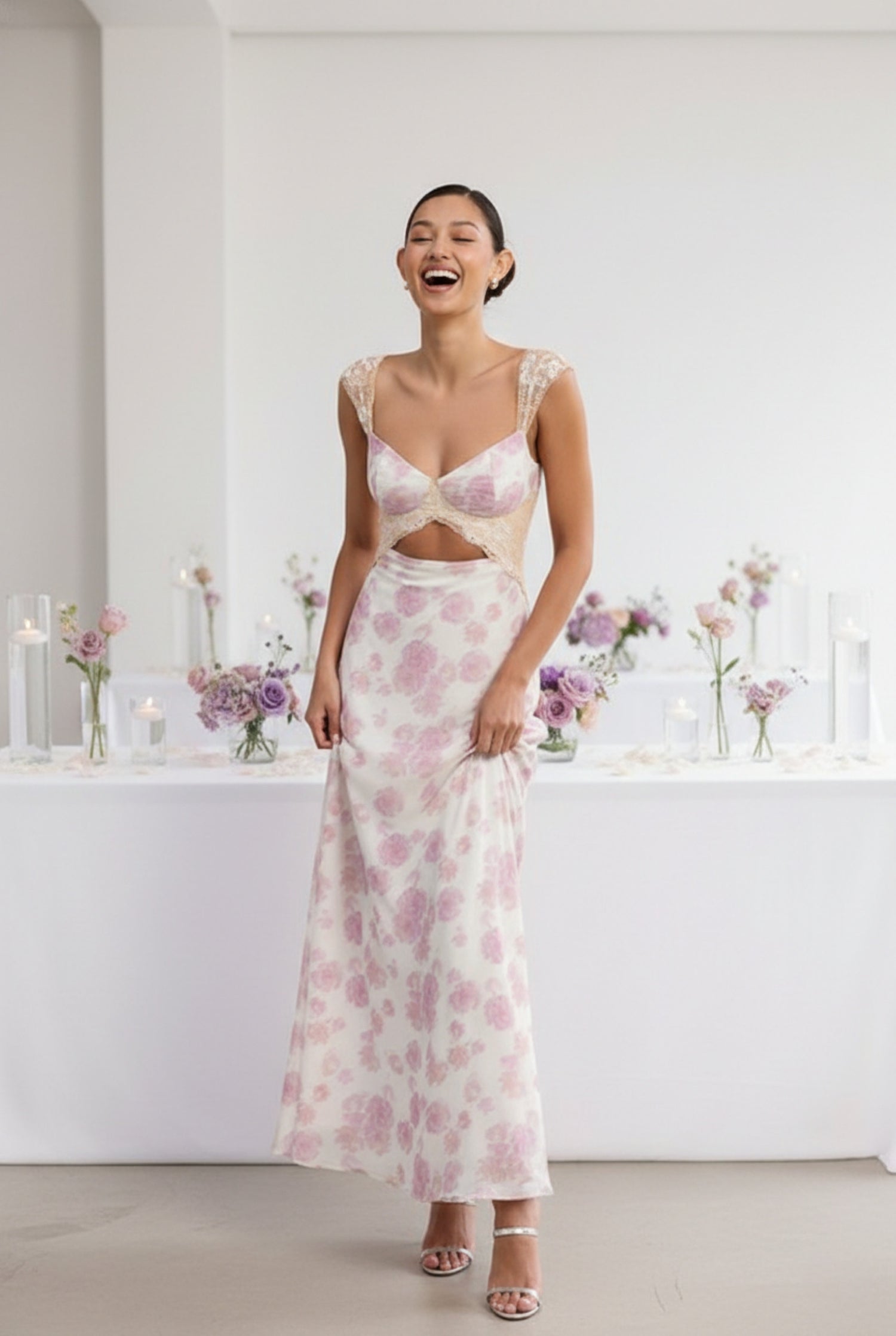 Model wearing Emory Park Floral Mesh Lace Trim Purple Maxi Dress With Bust Cutout featuring floral pattern laughing at wedding reception