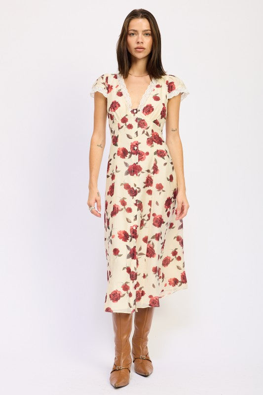 Emory Park model wearing a cream Floral Midi Dress With Lace Detail with red floral print V neck and cap sleeves