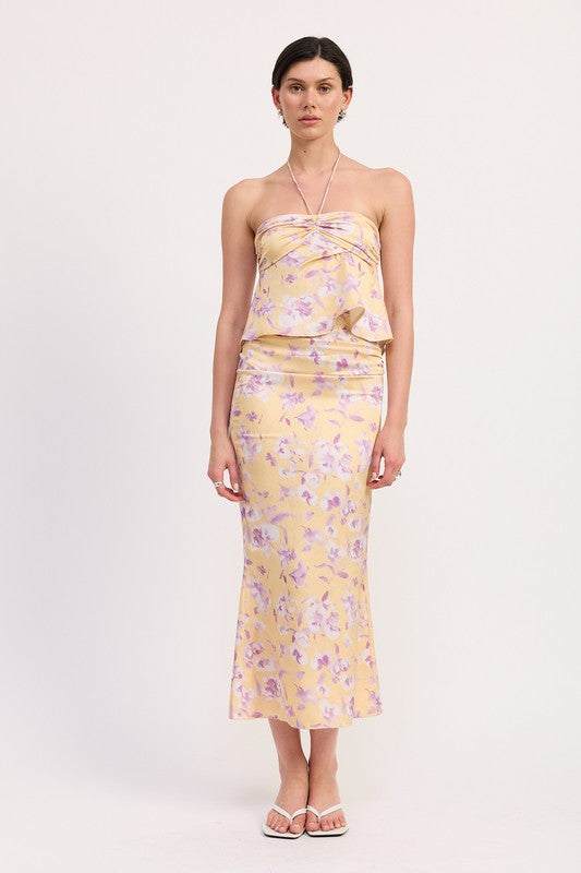 Woman wearing Emory Park Floral Strapless Ruched Halter Top with matching floral skirt and sandals