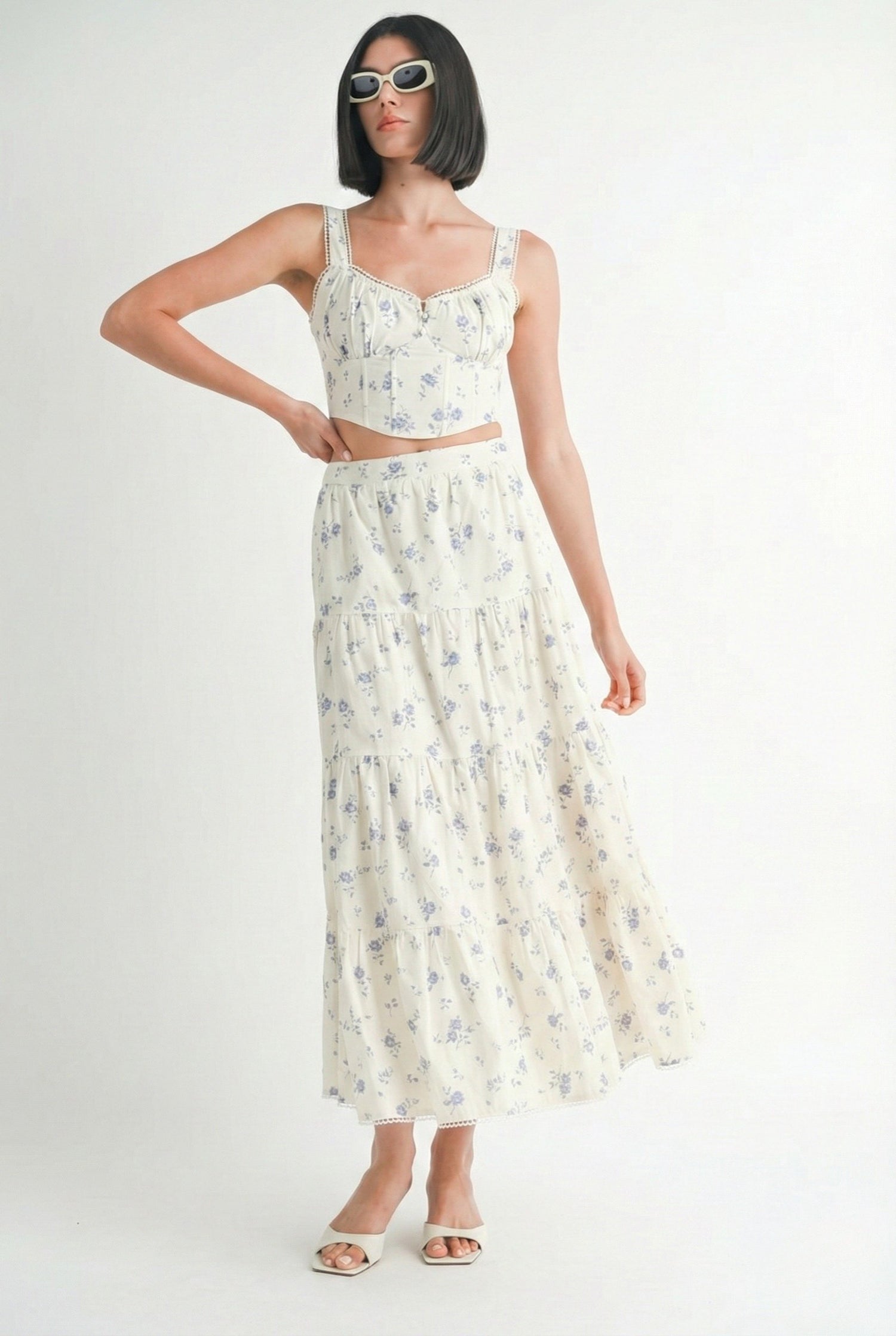 Woman wearing a floral dress on a white background