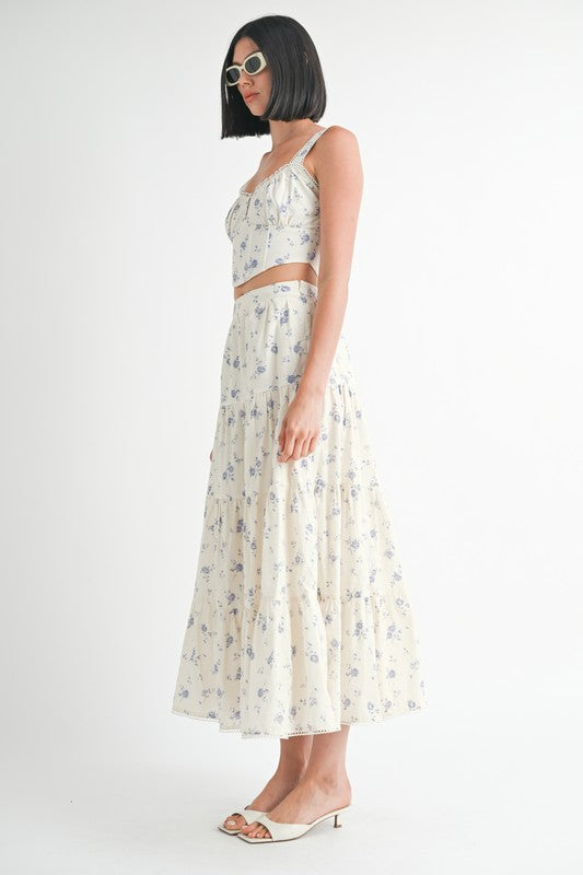 Emory Park floral tiered maxi skirt worn with matching cropped top and sunglasses