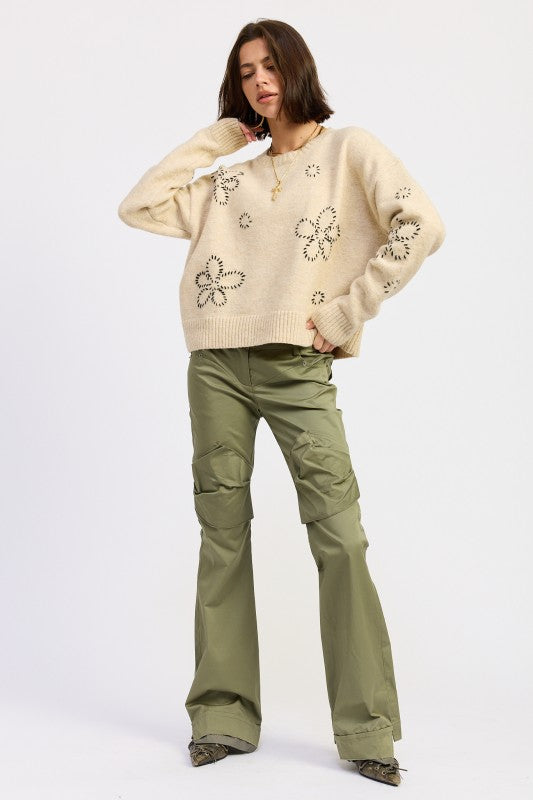 Emory Park Floral Whipstitch Sweater in a beige color with floral embroidery, paired with green cargo pants