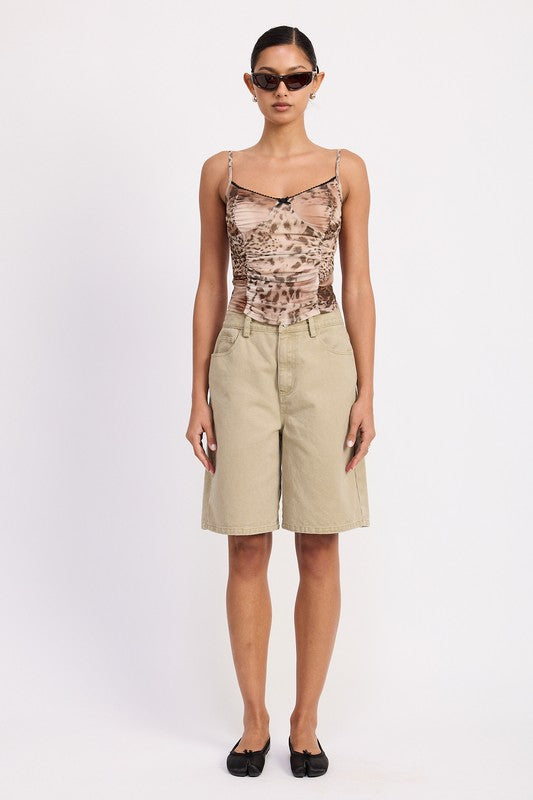 Emory Park beige High Rise Wide Leg Denim Pants worn by woman with animal print top and sunglasses