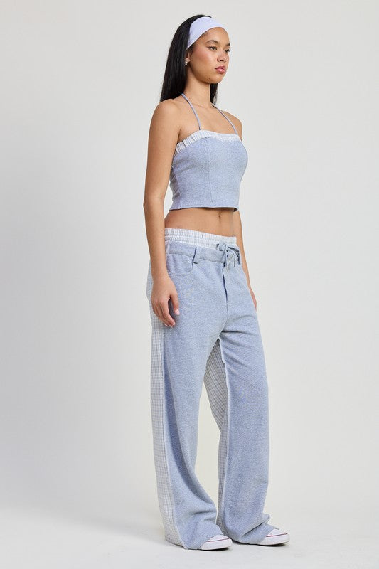 Emory Park woman wearing a blue Halter Neck Cropped Top paired with matching relaxed pants