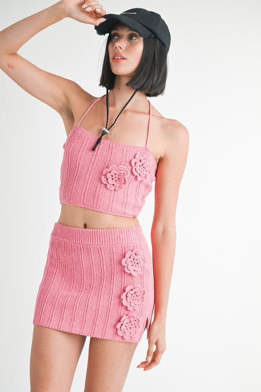 Emory Park pink Halter Neck Knitted Cropped Top with floral accents worn with matching skirt