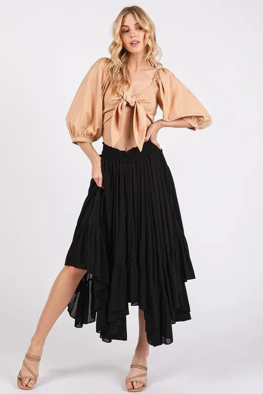Handkerchief hem midi skirt in black with elegant flowing design and stylish silhouette