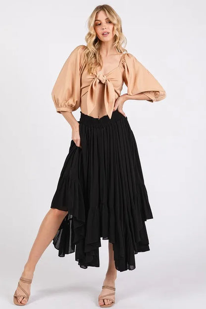 Handkerchief hem midi skirt in black with elegant flowing design and stylish silhouette
