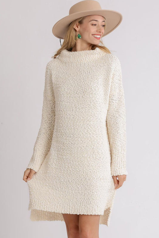 High-low boucle sweater dress in cream with long sleeves and comfortable loose fit