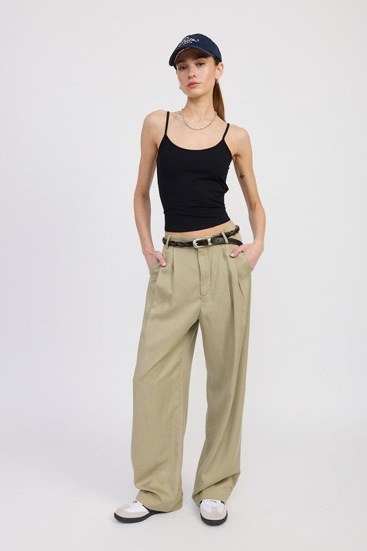 Emory Park high waist wide leg trousers with front pleats in beige worn with black tank top and cap