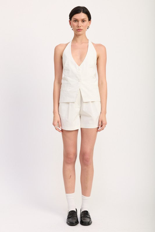 Emory Park high waisted pleated shorts in white worn with matching sleeveless top and black loafers