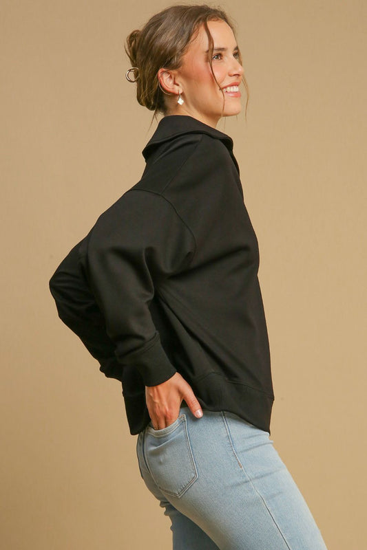 Model wearing a Johnny Collar Dropped Shoulder Sweatshirt in black, styled with light blue jeans