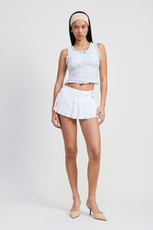 Emory Park Lace Ruffle Edge Top in white worn with white pleated skirt and beige heels