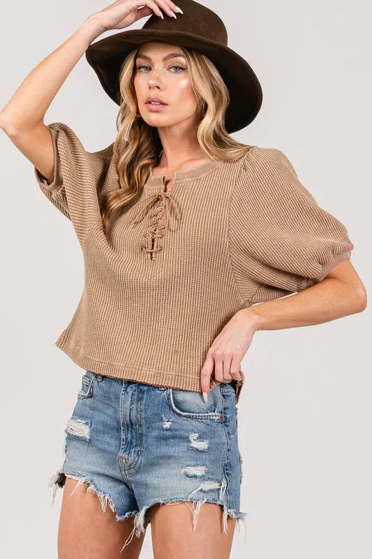 Lace-Up Waffle Knit Top in tan with a relaxed fit and short sleeves, styled with distressed shorts