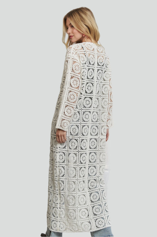 Back view of a Long Sleeve Crochet Cardigan with a unique lace pattern and open design