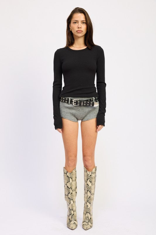 Emory Park Long Sleeve Ribbed Top with Chain Detail in black, styled with shorts and snake print boots