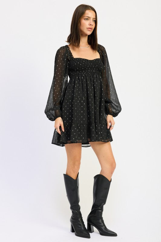 Emory Park Long Sleeve Smocked Baby Doll Mini Dress in black with sheer sleeves and a flowy skirt
