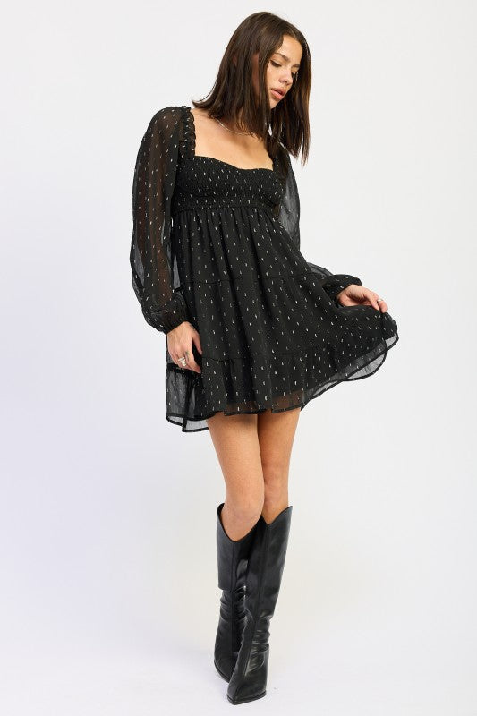 Emory Park Long Sleeve Smocked Baby Doll Mini Dress in black with a flowy silhouette and textured fabric