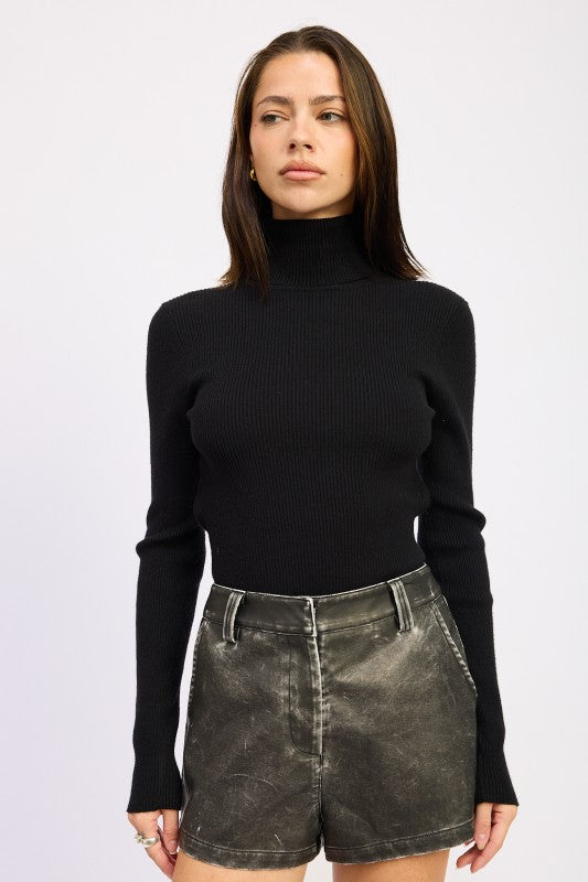 Emory Park Long Sleeve Turtle Neck Bodysuit in black, paired with stylish denim shorts for a chic look