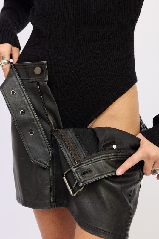 Black Emory Park Long Sleeve Turtle Neck Bodysuit paired with a stylish leather skirt