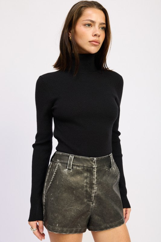Emory Park Long Sleeve Turtle Neck Bodysuit in black, layered under stylish shorts for a chic look