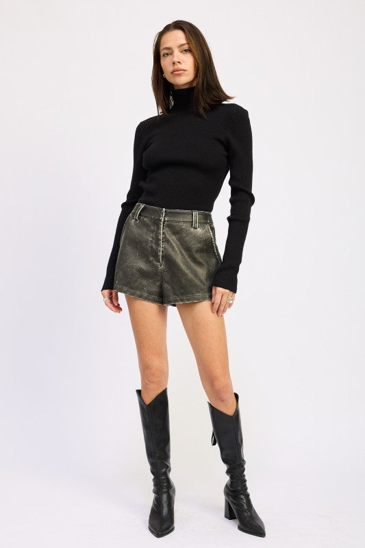 Emory Park Long Sleeve Turtle Neck Bodysuit in black paired with leather mini skirt and knee-high boots