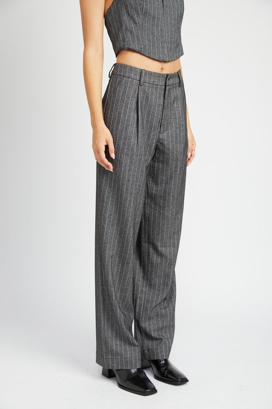 Emory Park loose fit pinstripe pants in gray worn with a matching cropped top and black shoes