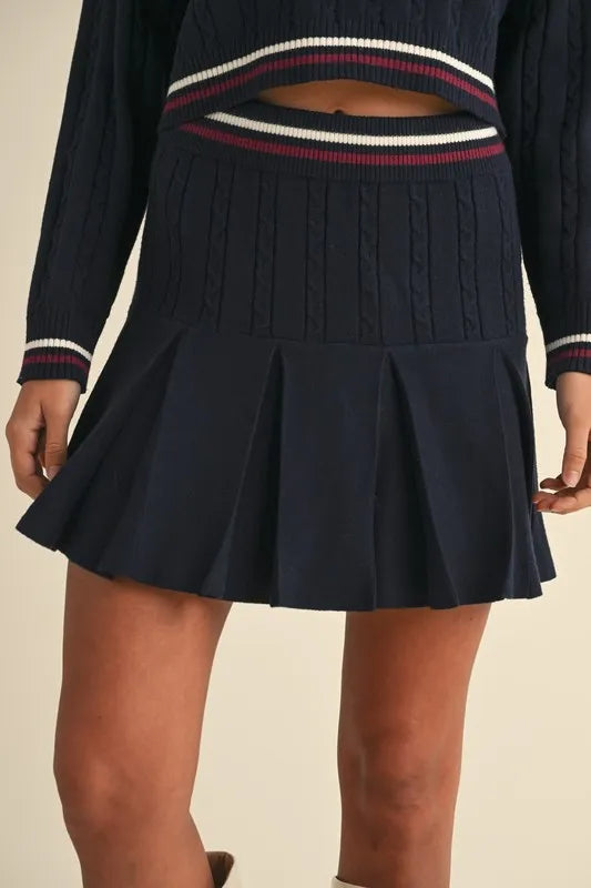 MABLE V-Neck Varsity Crop Knit Sweater and Skirt Set featuring a pleated navy skirt with a stylish design