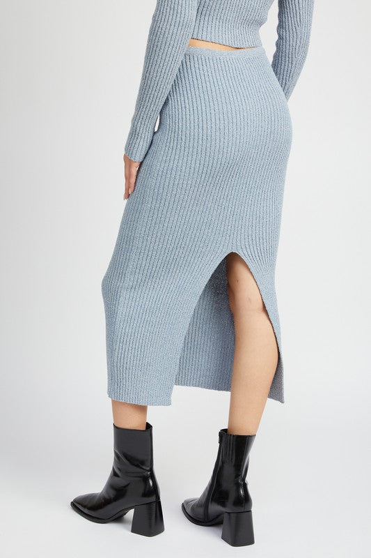 Emory Park Maxi Knit Skirt With Back Slit in light blue ribbed fabric paired with black ankle boots