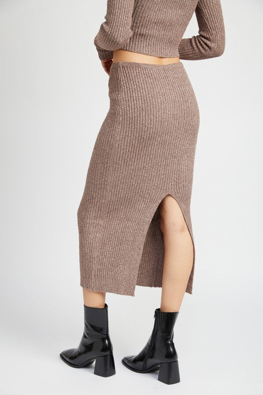 Emory Park Maxi Knit Skirt With Back Slit in brown ribbed fabric paired with black ankle boots