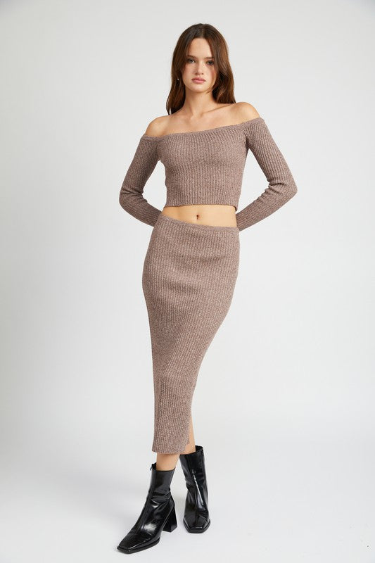 Emory Park Maxi Knit Skirt With Back Slit in brown worn with matching off shoulder knit top and black boots