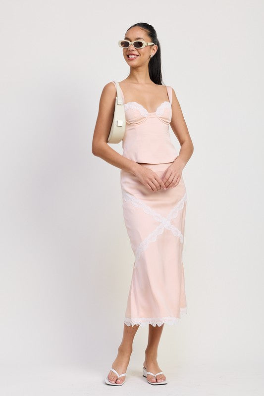 Emory Park Midi Satin Skirt With Lace Detail in soft pink worn by model with matching top and white accessories