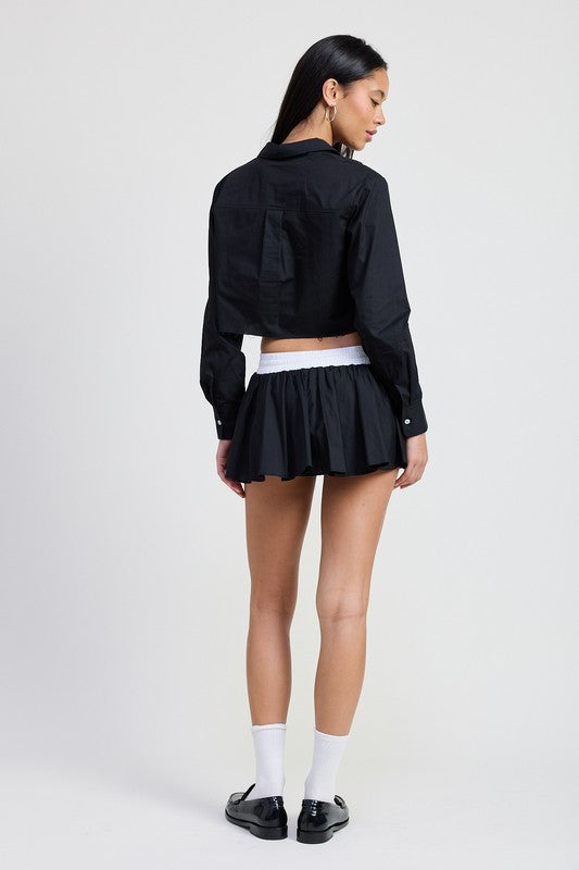 Emory Park Mini Contrast Waistband Skirt in black with white waistband styled with black cropped jacket