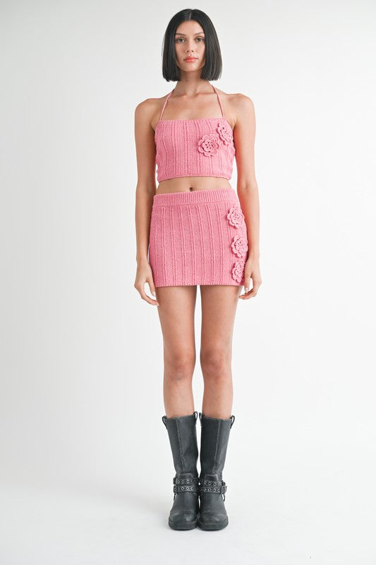 Emory Park pink Mini Crochet Skirt with floral details worn with matching crop top and black boots